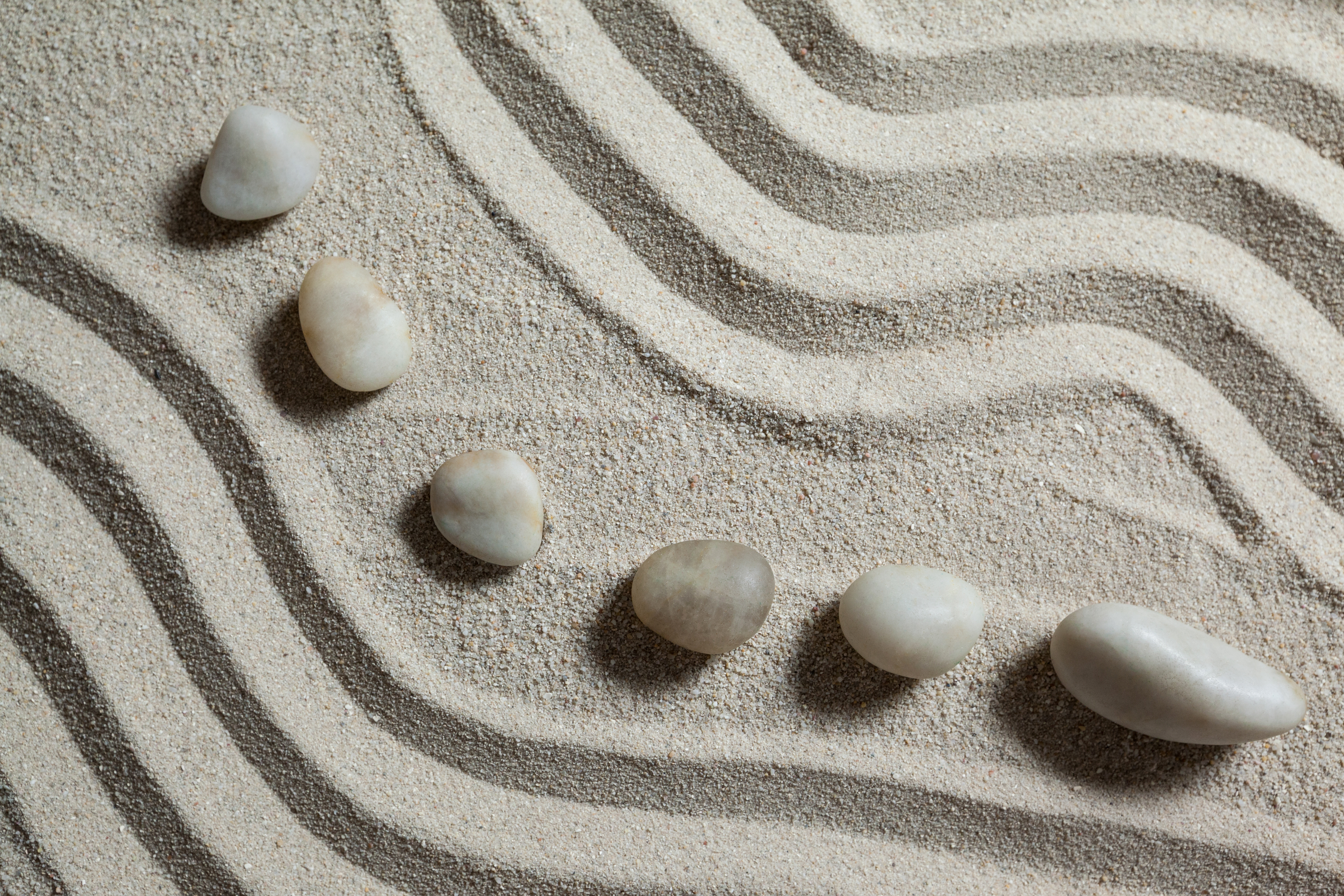 rocks in sand zen garden arrangement